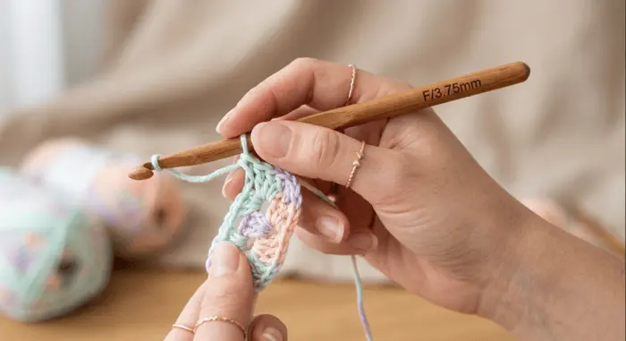 how to hold a crochet hook – Your hand sits over the hook (an underhand style)